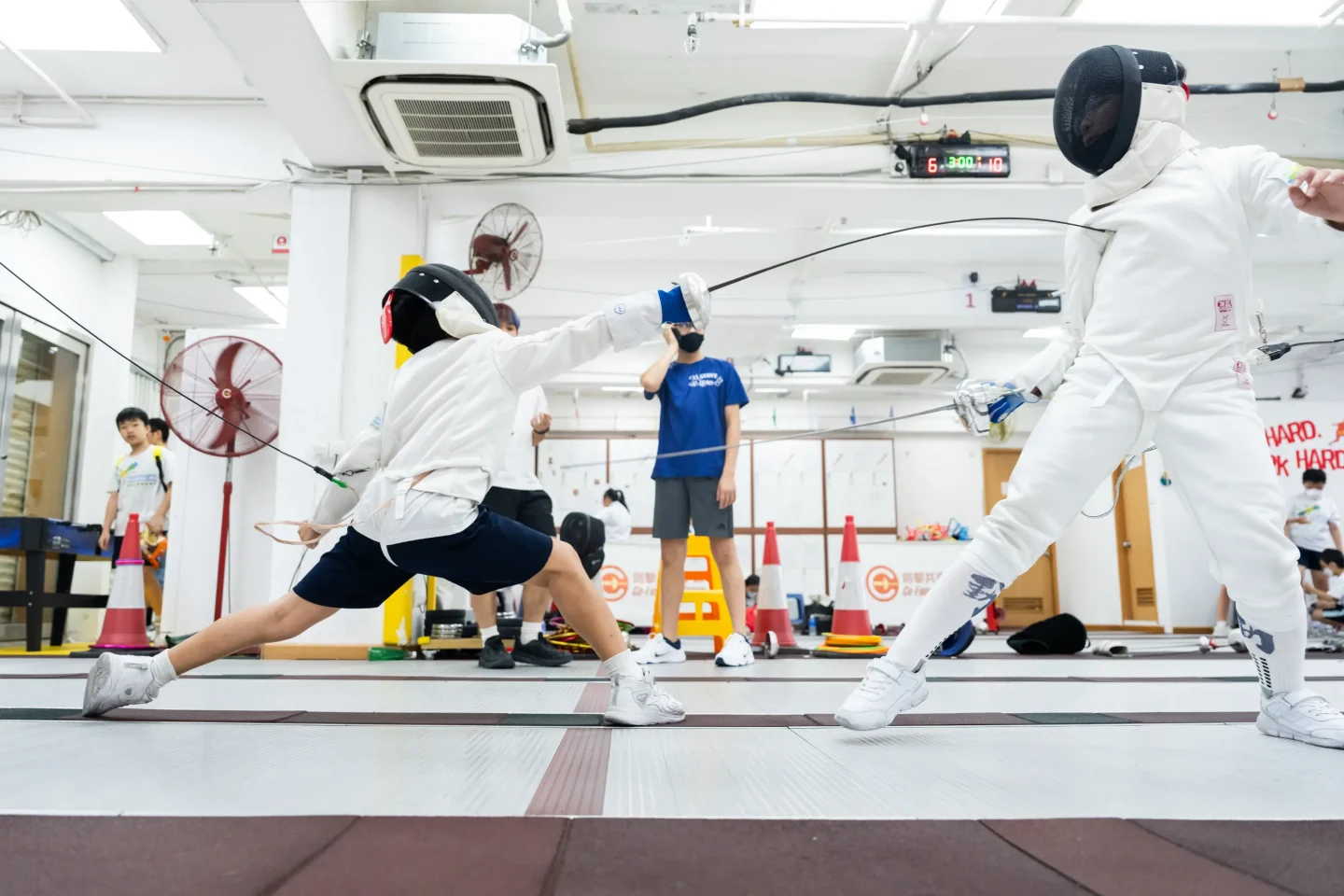 FENCING Inspires! students participating in inter-class competition